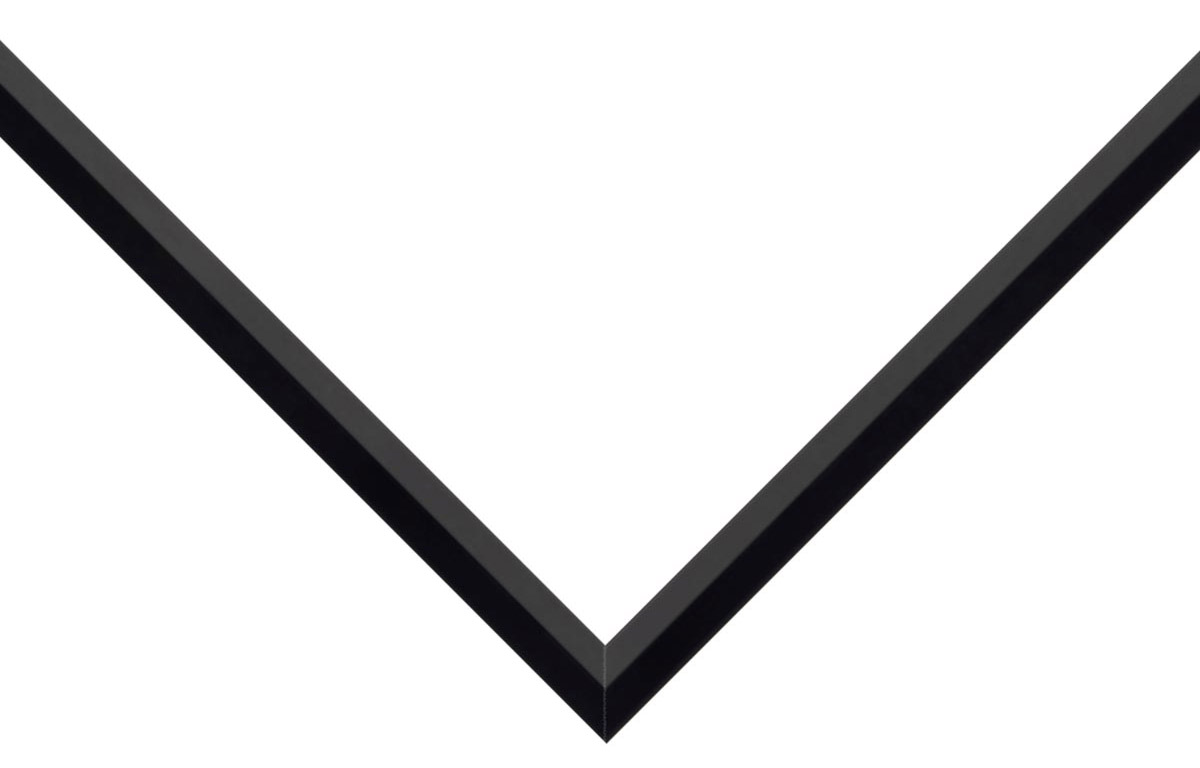 Beveled Black picture frame moulding shown at the miter join