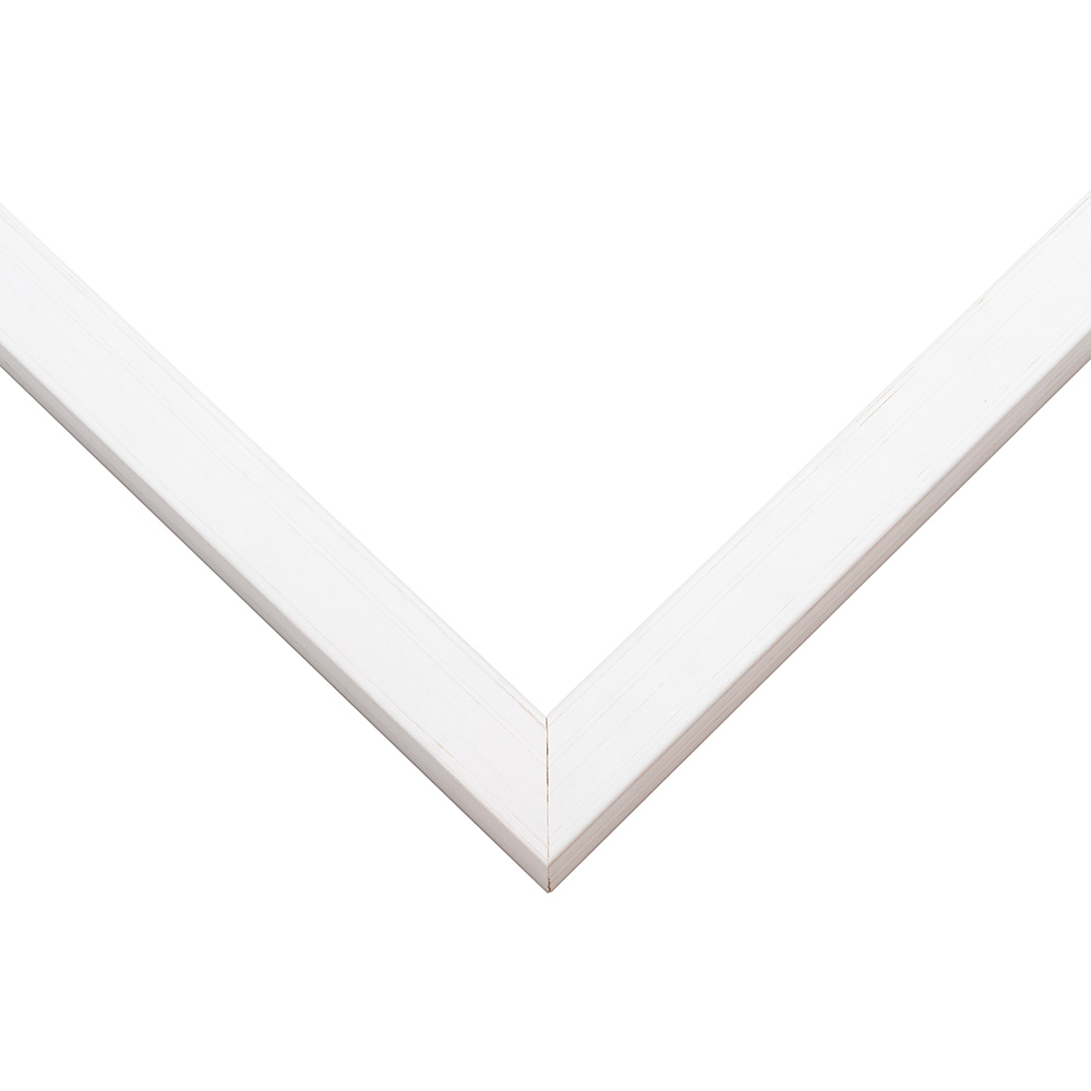 Whitewash picture frame moulding shown at the miter join